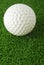 Golf ball on the green grass turf