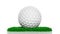 Golf ball on green turf patch