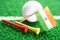 Golf ball with India flag and tee on green lawn or grass is most popular sport in the world
