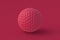 Golf ball of magenta on red background. Color of the year 2023