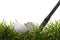 Golf ball in tall grass with 7 iron