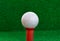 Golf ball,tee on the blur grass background.