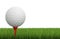 Golf ball on tee with green grass