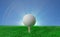 Golf ball on tee on green turf