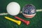 Golf ball with USA flag and tee on green lawn or grass, most popular sport in the world