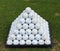 Golf balls pyramid on driving range