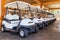 Golf buggy parked. Many in a row.