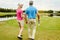 Golf can teach you a lot about someone. a mature couple out playing golf together.