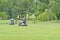 Golf carts on a green golf course