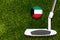 A golf club and a ball with flag Kuwait during a golf game