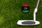 A golf club and a ball with flag Libya during a golf game