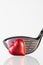 Golf club and red heart on a glass table