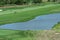 Golf course fairway with water hazard