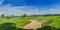 Golf course green under blue cloud sky for scene background