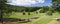 Golf course in mountain terrain pano