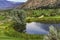 A golf course in the Okanagan Valley near Osoyoos British Columbia Canada with Osoyoos Lake in the background