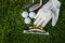 Golf equipment on green grass, ball, glove, tee and golf-club driver, golf gear and equipment on flat lay top view