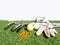 Golf essentials with artificial grass on white background