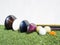 Golf essentials with artificial grass on white background