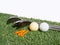 Golf essentials with artificial grass on white background