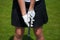 Golf player gloves hold the iron or putter