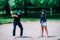 Golf sand bunker playing technique. Young woman practicing bunker shots with golf instructor