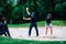 Golf sand practice shots. Young woman having a lesson with golf instructor