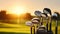 Golf Stick on The Bag Resting Upon the Lush Green as the Sun Sets in the Background