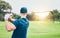 Golf, stroke and back with a sports man swinging a club on a field or course for recreation and fun. Golfing, grass and