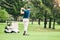 Golf, stroke and focus with a sports man swinging a club on a field or course for recreation and fun. Golfing, grass and