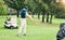 Golf, stroke and hobby with a sports man swinging a club on a field or course for recreation and fun. Golfing, grass and