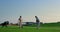 Golf team play sport on green grass field club. Two golfers teeing hitting ball.