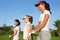 Golf three woman in a row green grass course