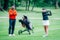 Golf training. Two young ladies with golf instructor having a lesson on a golf course