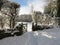 Golf trolley tracks through the snow.