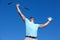 Golf, winner and man with hands up in celebration on blue sky background, victory and excited. Sports, success and male