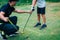 Golf â€“ Personal Training. Golf Instructor Teaching Young Boy How to Play Golf