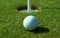 Golfball in front of the hole