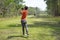 Golfer addressing the ball as he is about to tee off with a driver on a short four par