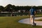 Golfer from back at course looking to hole in distance