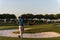 Golfer from back at course looking to hole in distance