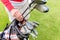 Golfer choosing best club in bag