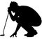 Golfer crouching on the golf course analyzing, planning the golf tee shot, golf swing with a golf club in hand. Golfer in a squat