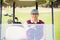 Golfer driving a golf buggy