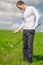 Golfer in full length on the field with balls