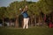 Golfer hitting a sand bunker shot on sunset