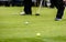 Golfer legs at golf tournament practice swing with golf club