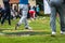 Golfer legs at golf tournament practice swing with golf club