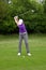 Golfer mid iron backswing