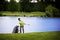 Golfer pitching at lake